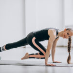 woman-practising-yoga-on-a-mat